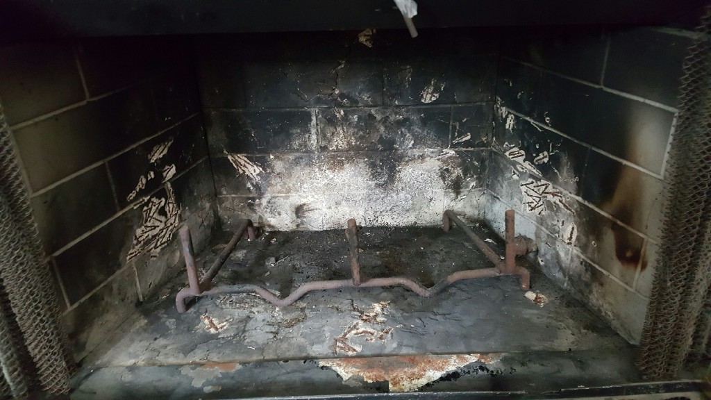 Dirty fireplace before repair